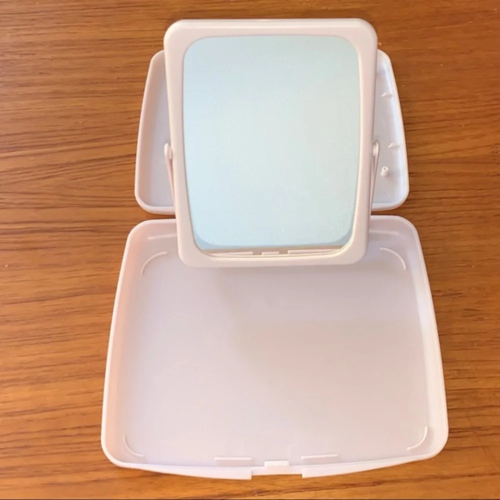 Mary Kay pink plastic compact travel mirror.